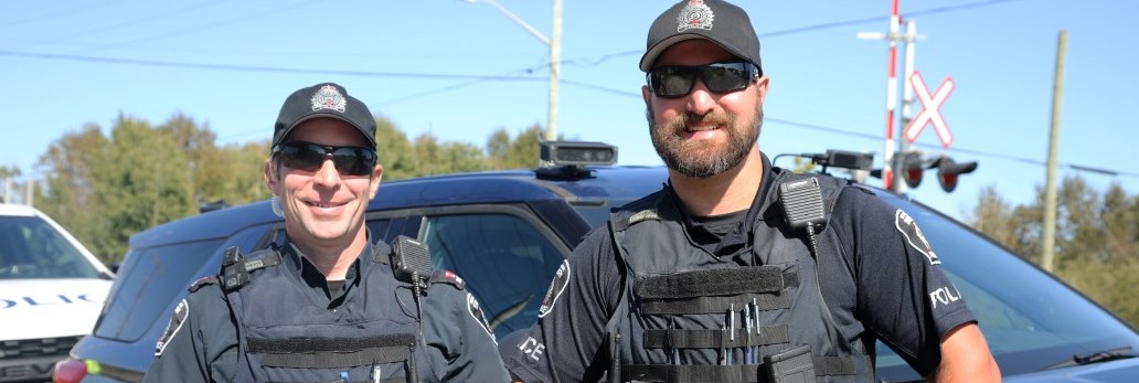 two officers smiling